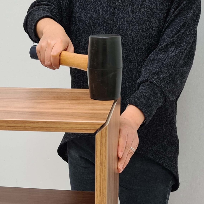 The image displays the final phase of a woodworking project, highlighting a piece of wood expertly connected and secured using the innovative FIYU® connector.